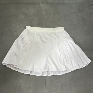 White pleated SPANX tennis skirt